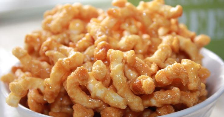 a white bowl filled with macaroni and cheese