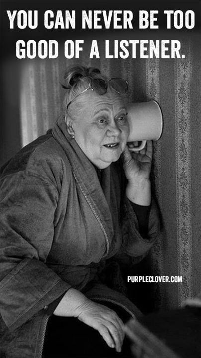 an old woman holding a megaphone up to her ear