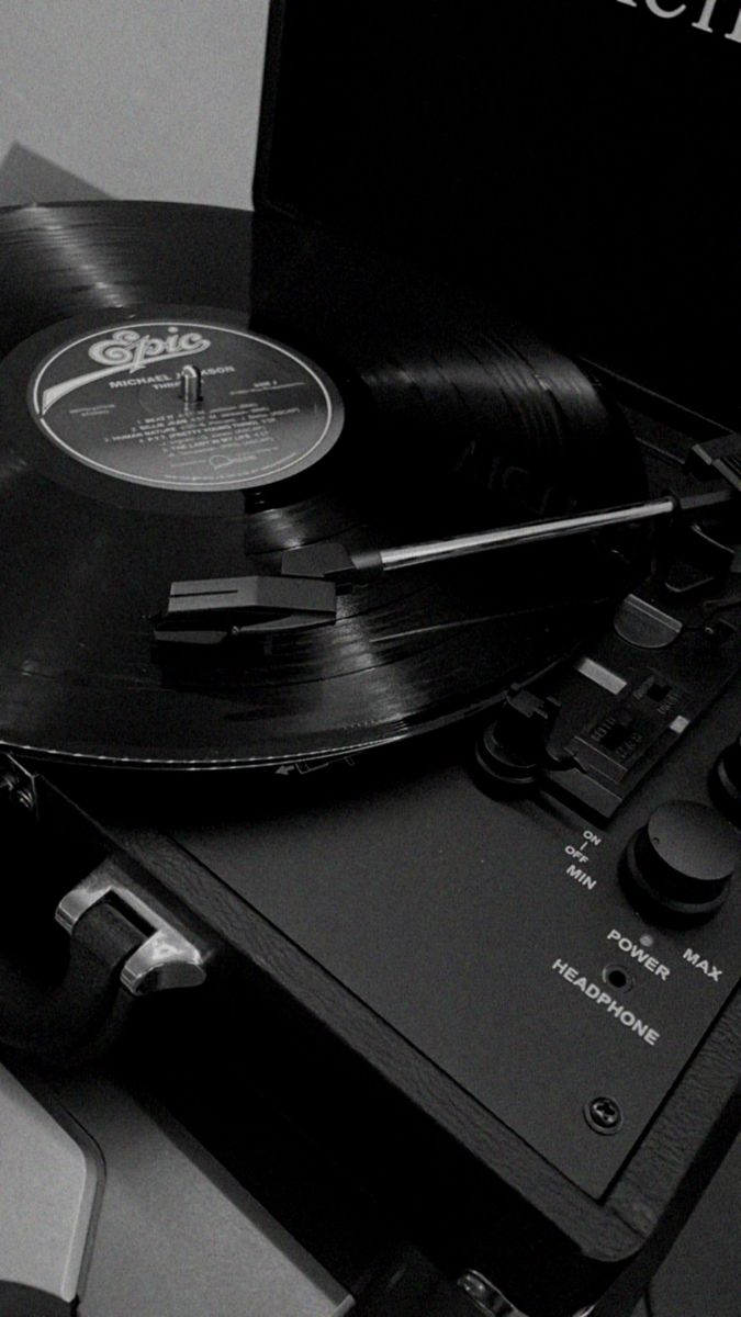 an old record player and turntable on a table