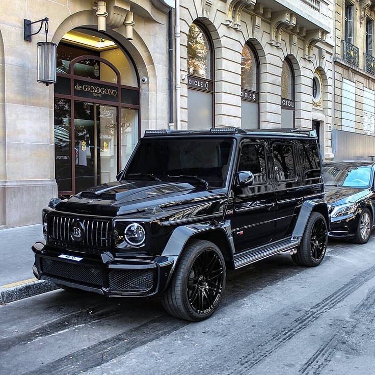 two cars parked on the side of a street