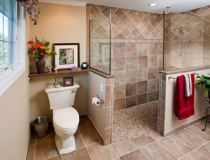 a bathroom with a toilet, shower and bathtub next to a window in it