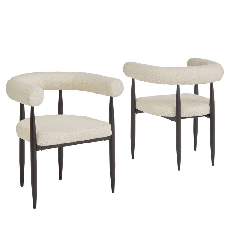 a pair of chairs with black legs and white upholstered seat covers on them