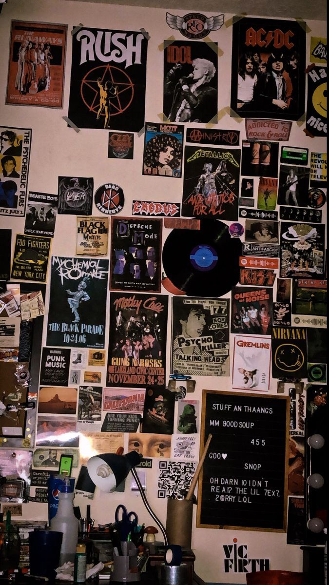 a wall covered with posters and vinyl records