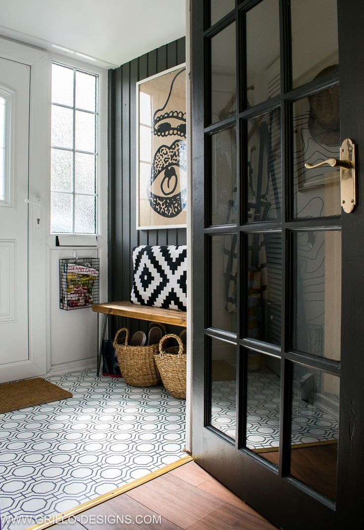 the entryway is decorated in black and white