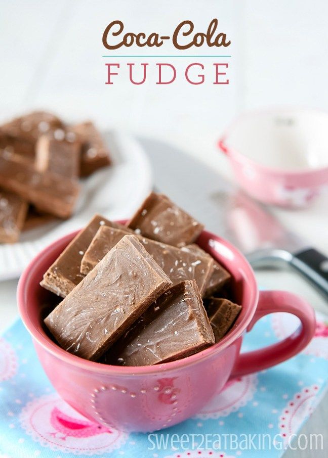 a pink mug filled with chocolate fudge on top of a blue and white napkin