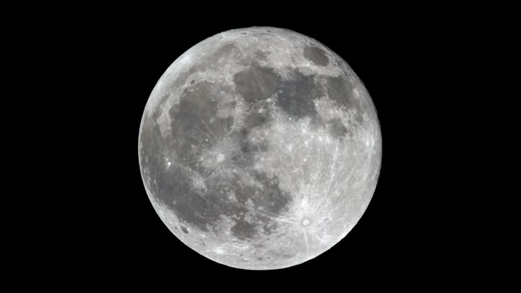 the full moon is seen in the dark sky