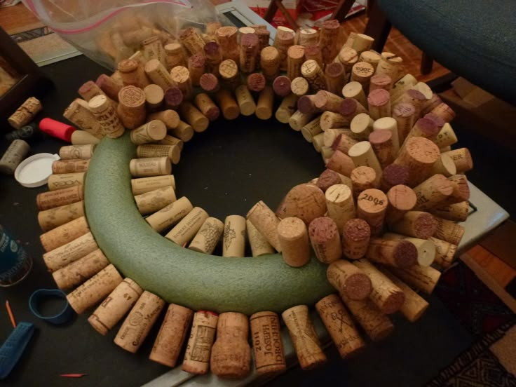 a wreath made out of wine corks on top of a table