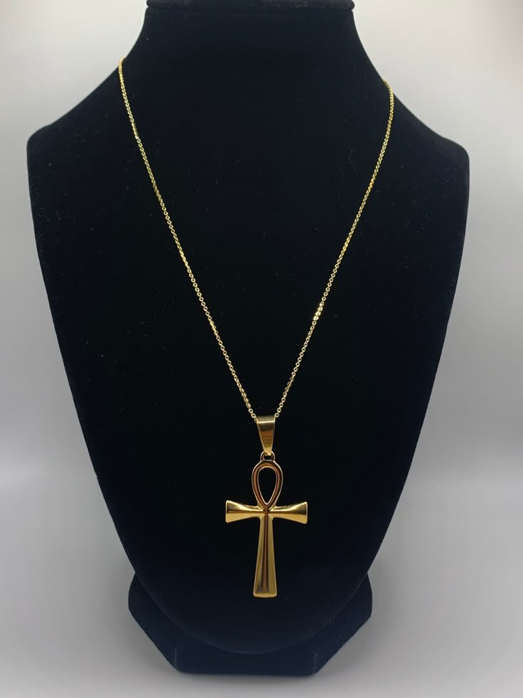 Ankh Necklace, Gold Ankh Necklace, Silver Ankh Necklace, Egyptian Necklace, Gold Necklace, Silver Necklace Elevate your style and spirituality with our Ankh Necklace. This timeless accessory is the perfect addition to any outfit.  Add a touch of sophistication with this beautiful, classic accessory that evokes positive energy and serves as a powerful symbol of life and eternity. Make a statement with this beautiful piece! Chain:     18K Gold Plated                  17.5 inch chain with 2 inch extender                  Lobster Claw Clasp Gold Pendant: 44.5mm long, 25.5mm wide Silver Pendant: 44.5mm long, 27mm wide Gold Spiritual Necklace, Cheap Ankh Spiritual Jewelry, Cheap Spiritual Chain Necklace, Cheap Spiritual Ankh Jewelry, Shifting Realities Symbol Necklace, Luxury Symbolic Ankh Necklaces, Luxury Gold Ankh Necklace, Cheap Ankh-shaped Spiritual Jewelry, Cheap Ankh Shaped Spiritual Jewelry