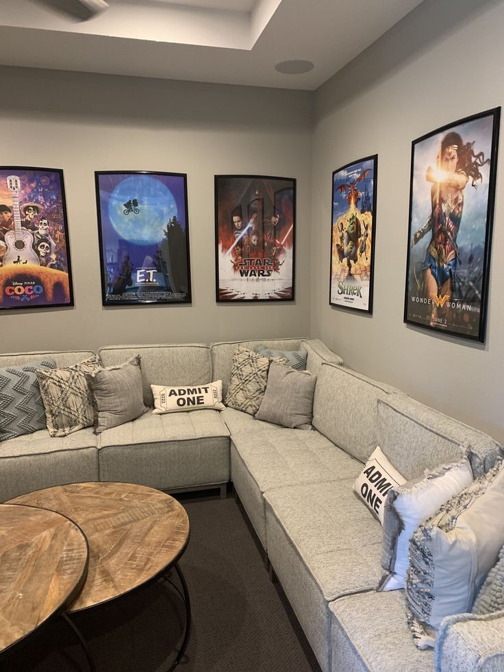 a living room filled with furniture and pictures on the wall above it's couch