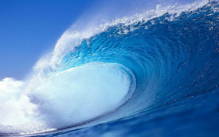 a large blue wave in the ocean