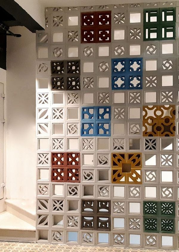 an art installation made out of different colored squares and circles on display in a room