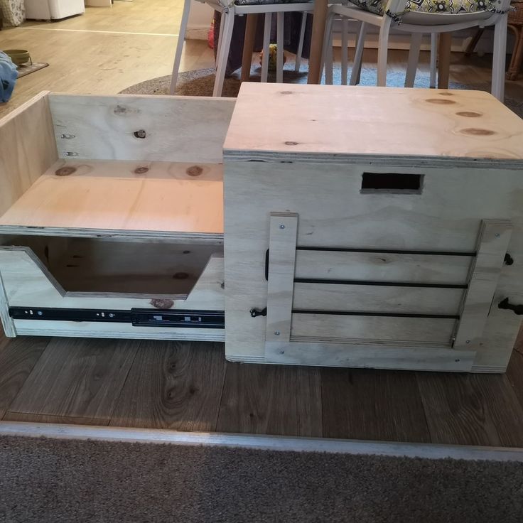 a wooden cabinet sitting on top of a hard wood floor