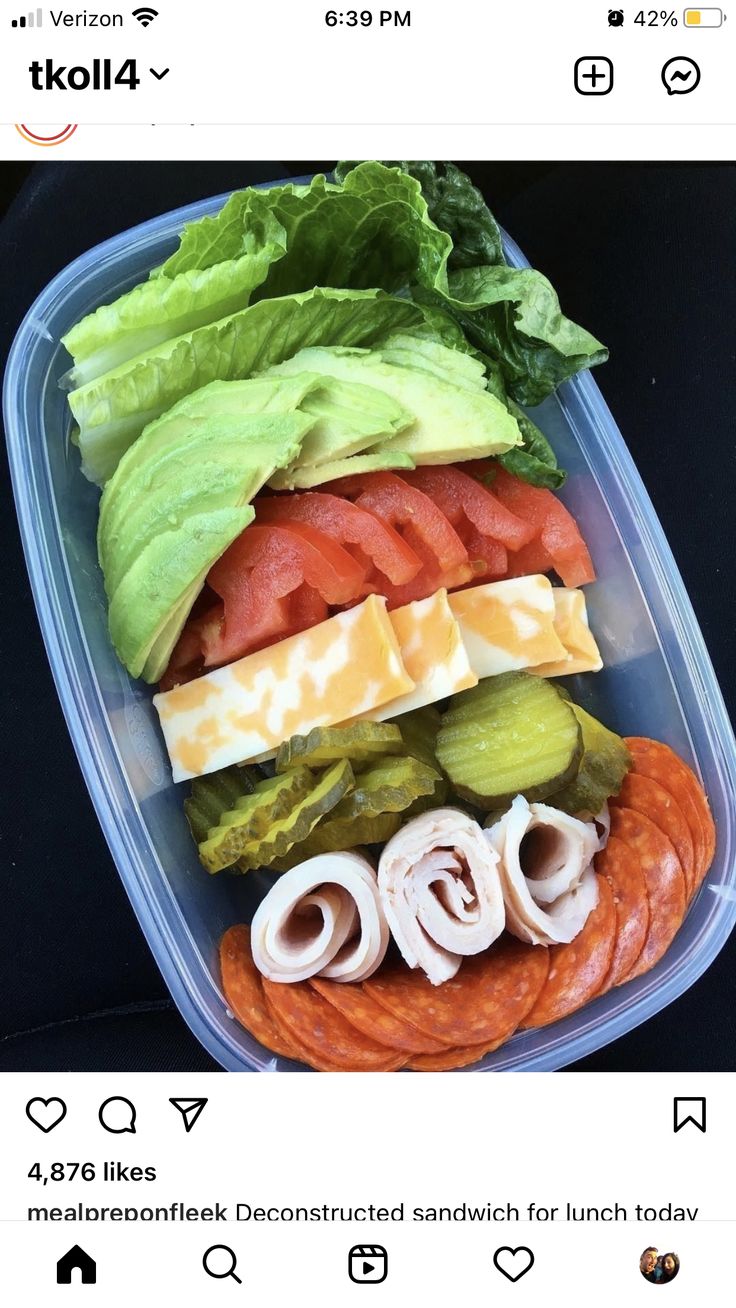 a plastic container filled with lots of different types of food on top of each other