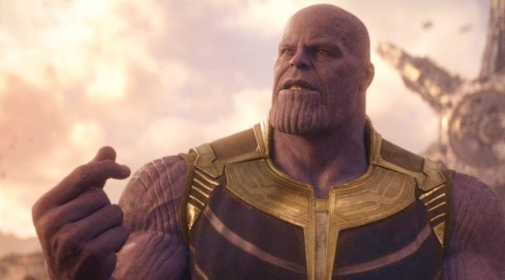 an image of thanos standing in front of the sky with his hand out to someone