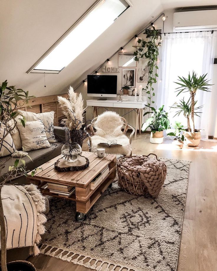 a living room filled with lots of furniture and plants on top of a wooden table