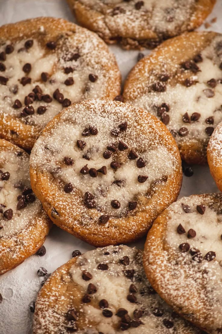 chocolate chip cookies with powdered sugar on top