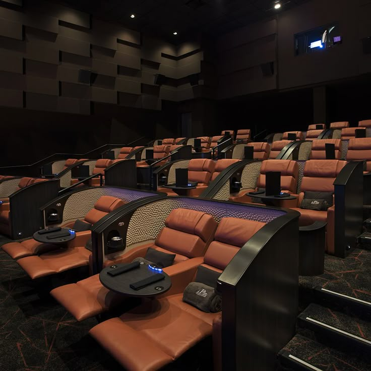 an empty auditorium with rows of seats in it