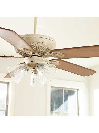 You don't have to live in the French countryside to appreciate the Chateaux 3-Light 52-Inch Ceiling Fan. Inspired by royal scepters, ornamental holders adorn the blades, while detailing at the housing , and included light kit, is truly a work of art. This traditional design adds a timeless look to any room.Dimensions: Total span for the 5 blades is 52", blade pitch 14 degrees. Energy information at high speed not including the lights is 3450 CFM, 47 Watts and 74 CFM/Watts. Lighting: 3 candelabra base sockets rated for 60W each. (Bulbs Included)The dimensions below are for standard mounting with 3 1/2" downrod, 6" also included. Hugger and 45 degree kit adaptable. Safety rating: dry location. A B 18 3/4" 10" Elegant Ceiling Fan Kitchen, French Cottage Ceiling Fan, Cottagecore Ceiling Fan, Vintage Ceiling Fans With Light, Ceiling Fan Bedroom Master Suite, French Country Ceiling Fan, Fans For Living Room, Vintage Ceiling Fan, Unique Ceiling Fan