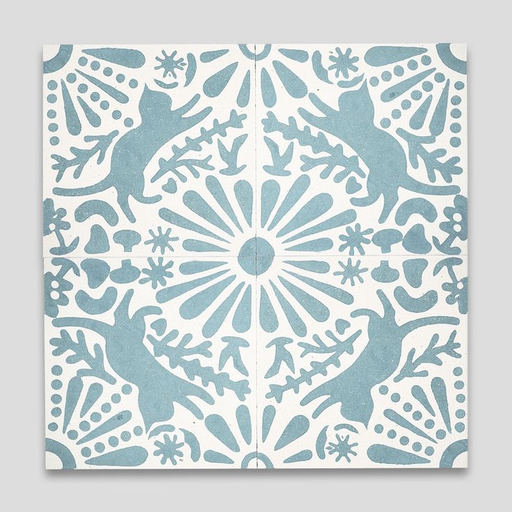 a blue and white tile with lizards on it