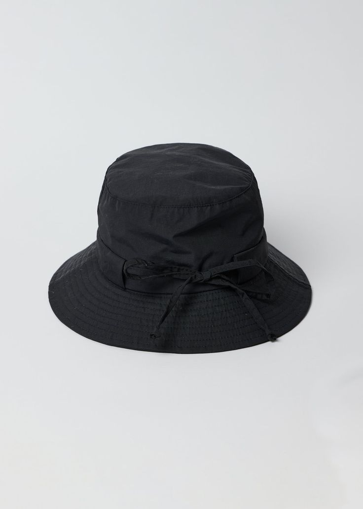 Our Water Resistant Rain Hat is a fashionable and fun take on our classic bucket hat that will keep you dry all season long. Shop Black Measurements: Brim Width- 2.45" Weight: 78g Professionally Dry Clean Rain Hat, Straw Fedora, Black Camel, Scarf Hat, Travel Collection, Medium Bags, Large Bags, Sun Hats, Arm Warmers