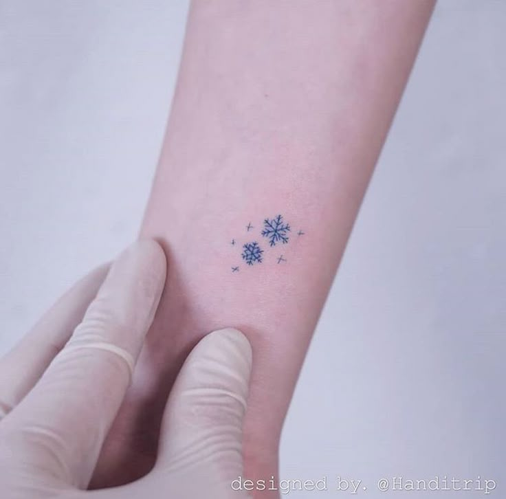 a person with a small tattoo on their arm