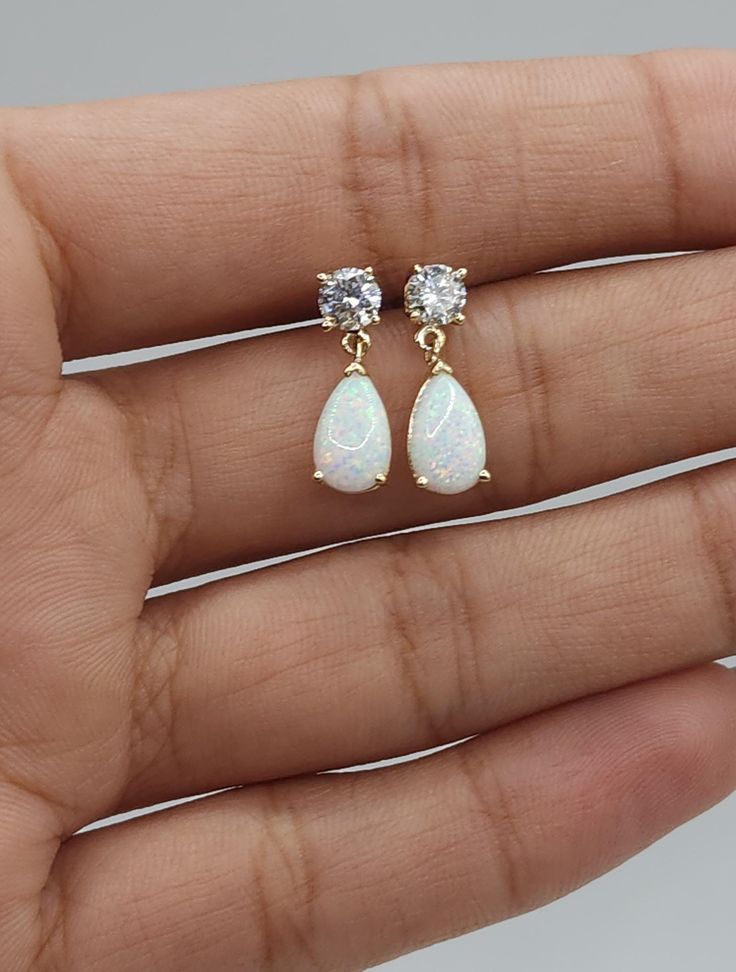 This is a beautiful teardrop design earrings that is handmade brand new. It is set in real Solid 14Kt Gold. You can choose if you want 14Kt White Gold, 14Kt Yellow Gold or 14Kt Rose Gold.  I have these earrings available with all gemstones that you can see in my store. This is the perfect gift for mom, wife, fiancee, girlfriend, valentine, daughter, family or friend. It is a special gift for mother's day, valentine's day, wedding, bridesmaid, anniversary, birthday, Christmas, Easter, New Year's White Opal Earrings, Earrings Opal, Birthstone Earrings, Handmade Brand, Birthstone Earring, Design Earrings, October Birthstone, Opal Earrings, Perfect Gift For Mom