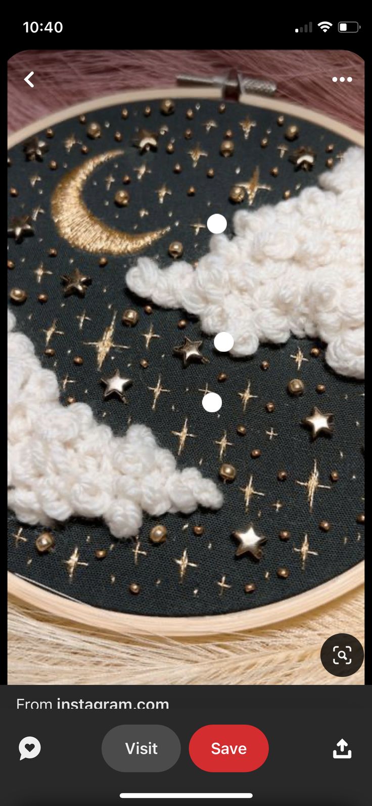 an embroidery project with stars and clouds on it