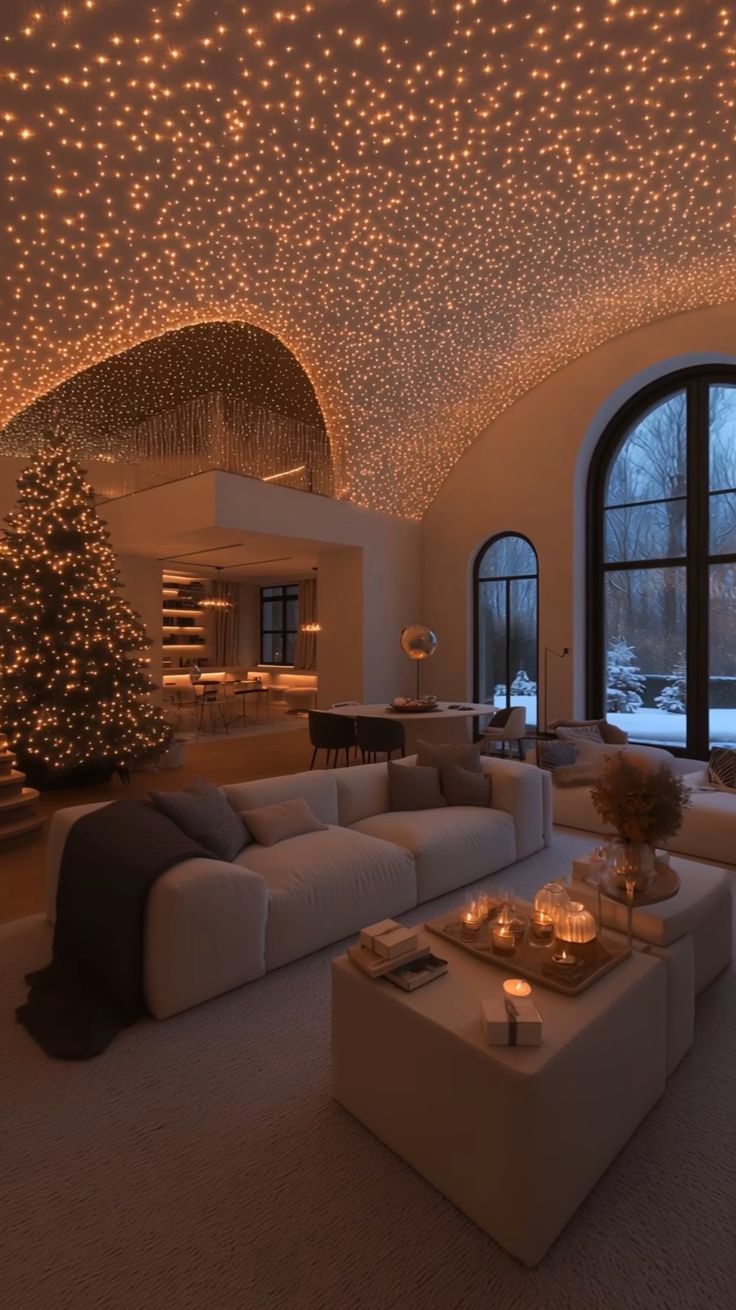 a living room filled with lots of furniture under a ceiling covered in stars and lights