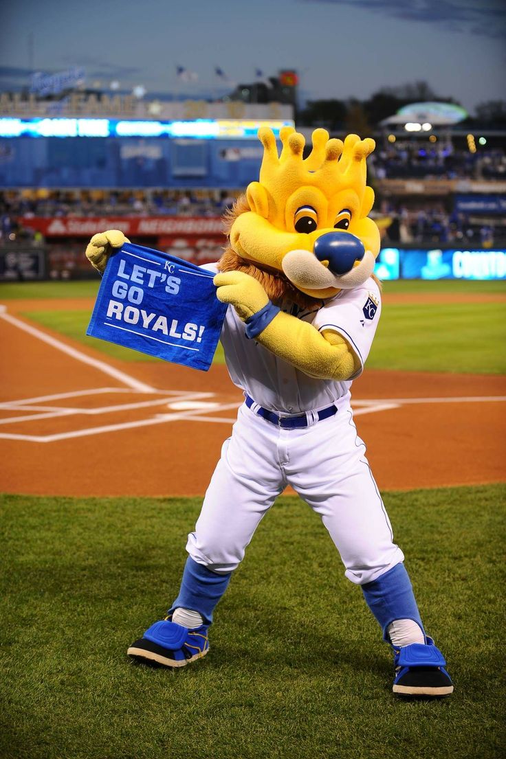 a mascot is holding a sign at a baseball game