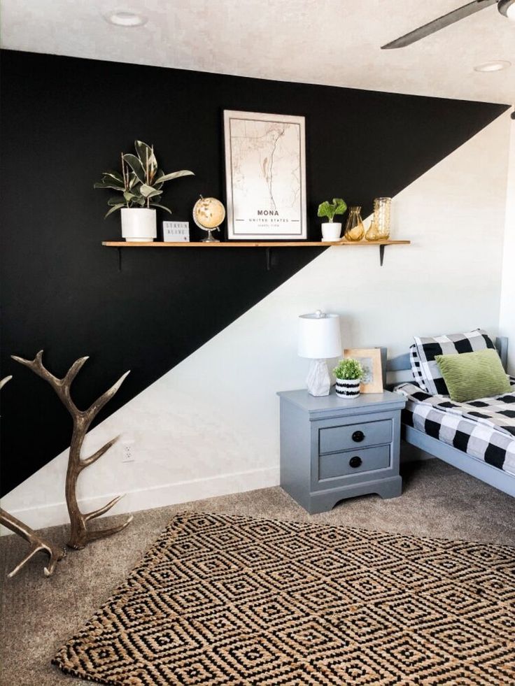 a black and white striped wall in a bedroom