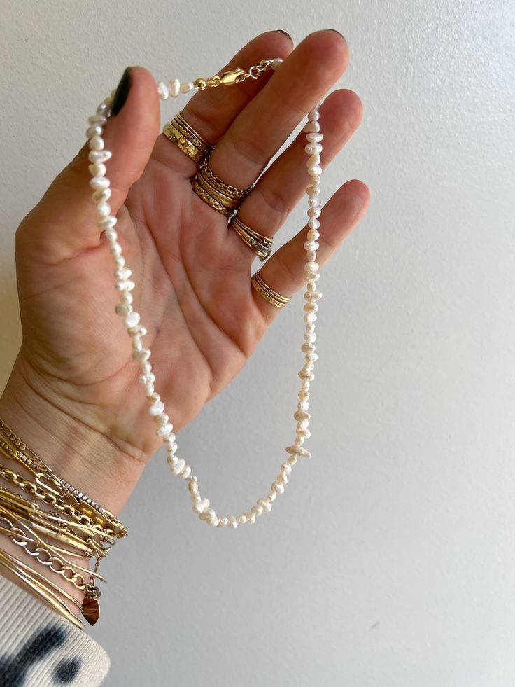 The delicate chain made of organic shaped fresh water pearls.This piece is made to order just for you, in small batches, each fresh water pearl is collected in a limited run and cannot be duplicated.Approximately 16 inches Made with 14k gold filled chain, components and freshwater cultured pearls. Jewelry Goals, Marie Antoinette Costume, Fresh Water Pearl Necklace, Water Pearl Necklace, Freshwater Pearl Jewelry, Saltwater Pearls, Bead Ideas, Fresh Water Pearls, Limited Run