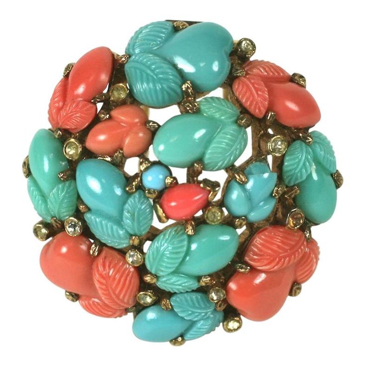 Trifari, Alfred Philippe round dome clip brooch of pink gold plated base metal, crystal rhinestones and faux coral, jade and turquoise fruit salad stones. This was produced as a pin with pastel coral fruit salads, signed KTF, before the change of marks in late 1937, suggesting a date for this of 1938. Excellent Condition. 1.65" x 1.65" Marked: Trifari with Crown Antique Costume Jewelry, Vintage Rhinestone Jewelry, Fruit Salads, Vintage Designer Jewelry, Trifari Jewelry, Cameo Jewelry, Crown Trifari, Vintage Jewelry Box, Couture Jewelry