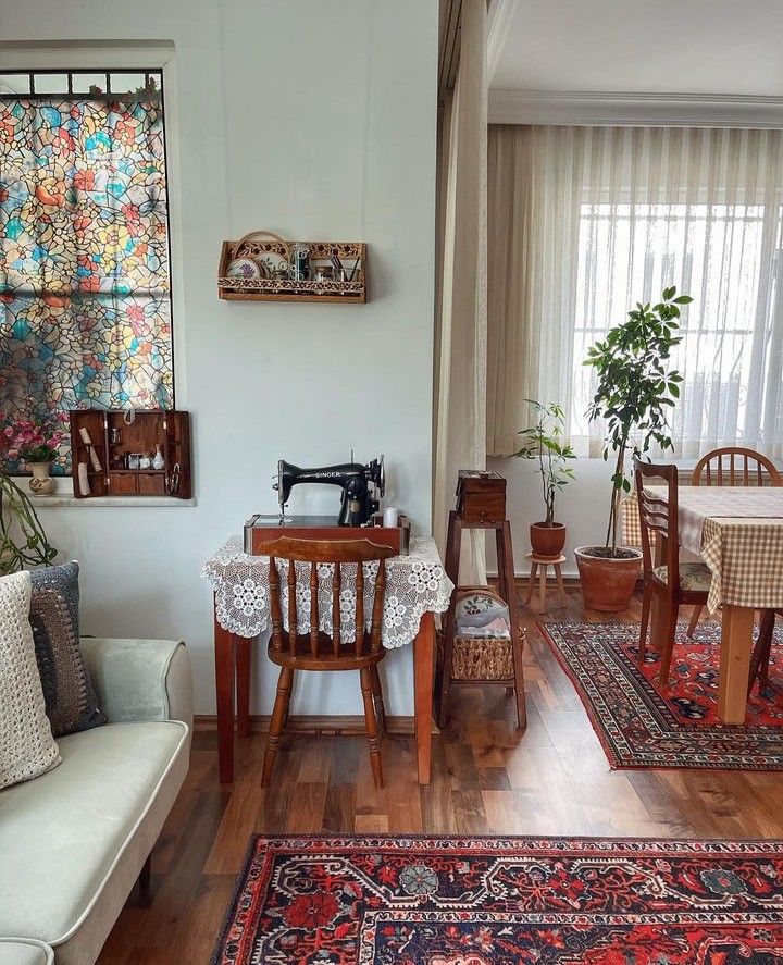 a living room filled with furniture next to a window