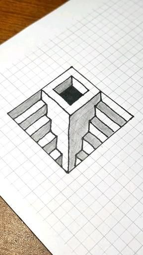 a pencil drawing of a square object on top of a piece of paper with squares around it