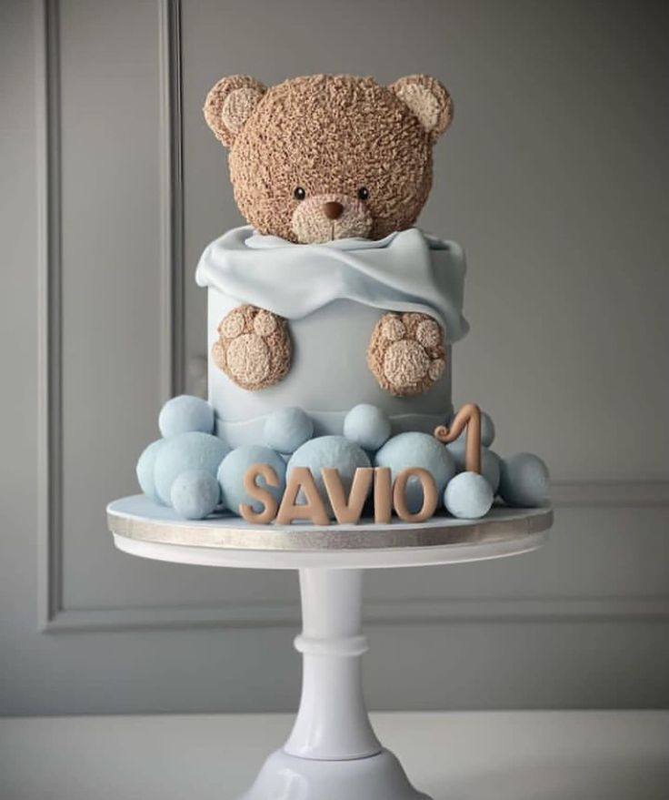 a teddy bear on top of a cake