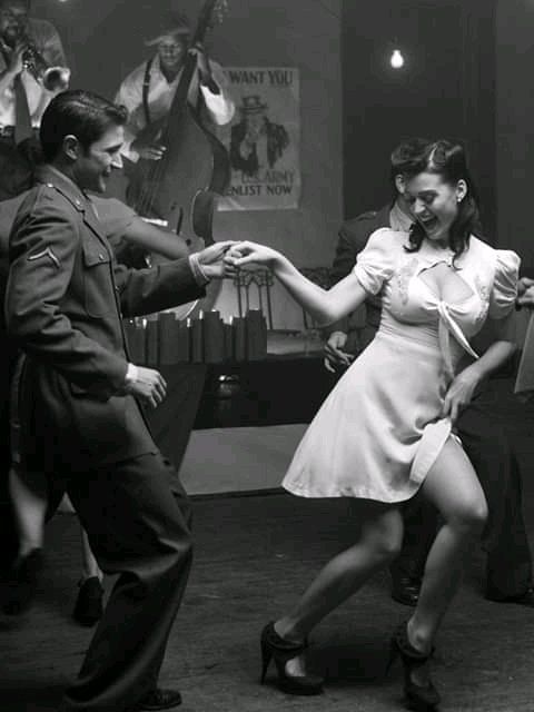 a man and woman are dancing together on the dance floor in an old - fashioned photo