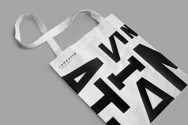 a black and white tote bag with the word art on it