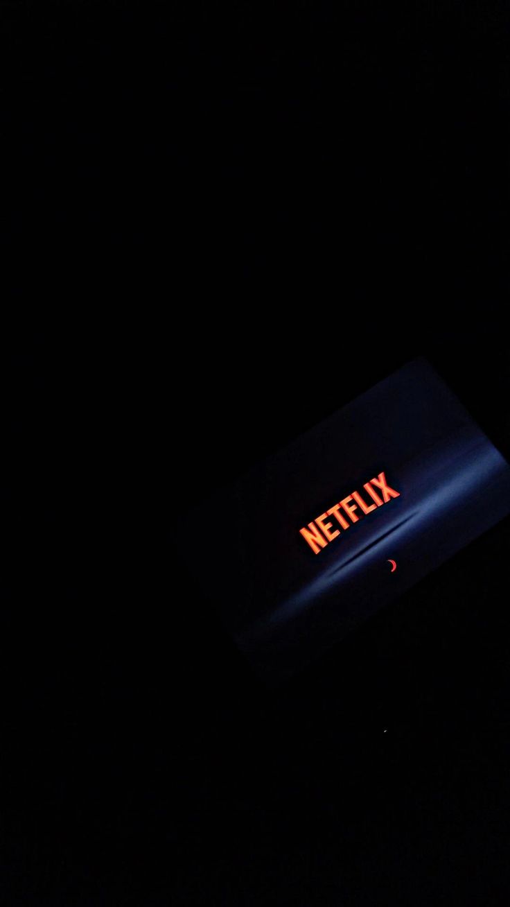 the netflix logo is lit up in the dark