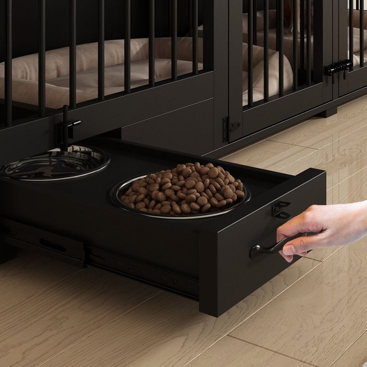 a person reaching into a dog bed with food in the bottom drawer on the floor