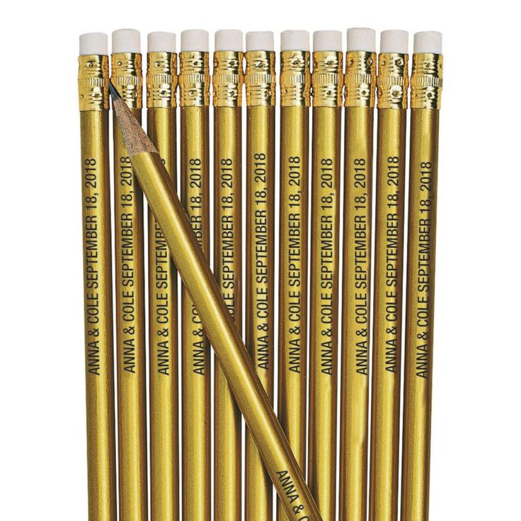 six gold colored pencils with writing on them