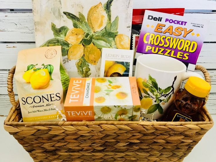 a wicker basket filled with books and snacks