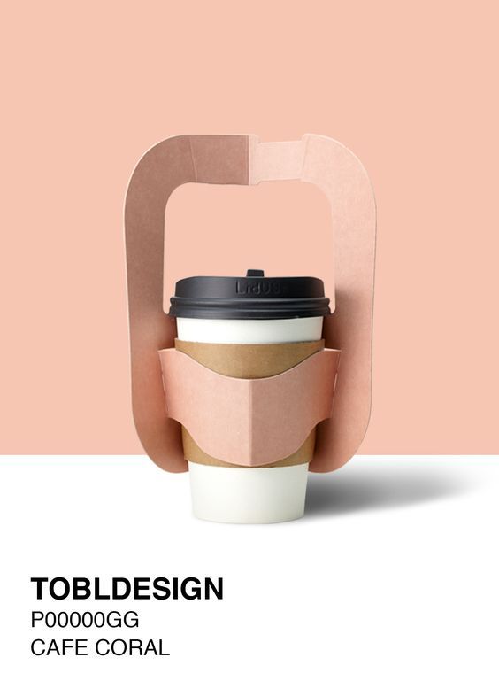 a coffee cup sitting on top of a pink and white background with the words tobler design