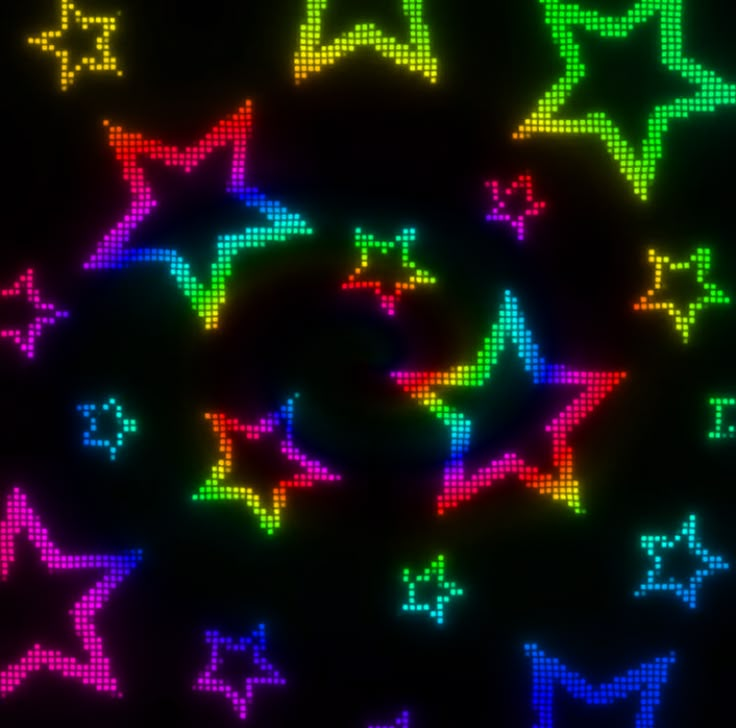 an image of colorful stars in the dark