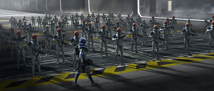 a group of people standing next to each other in front of a line of robots