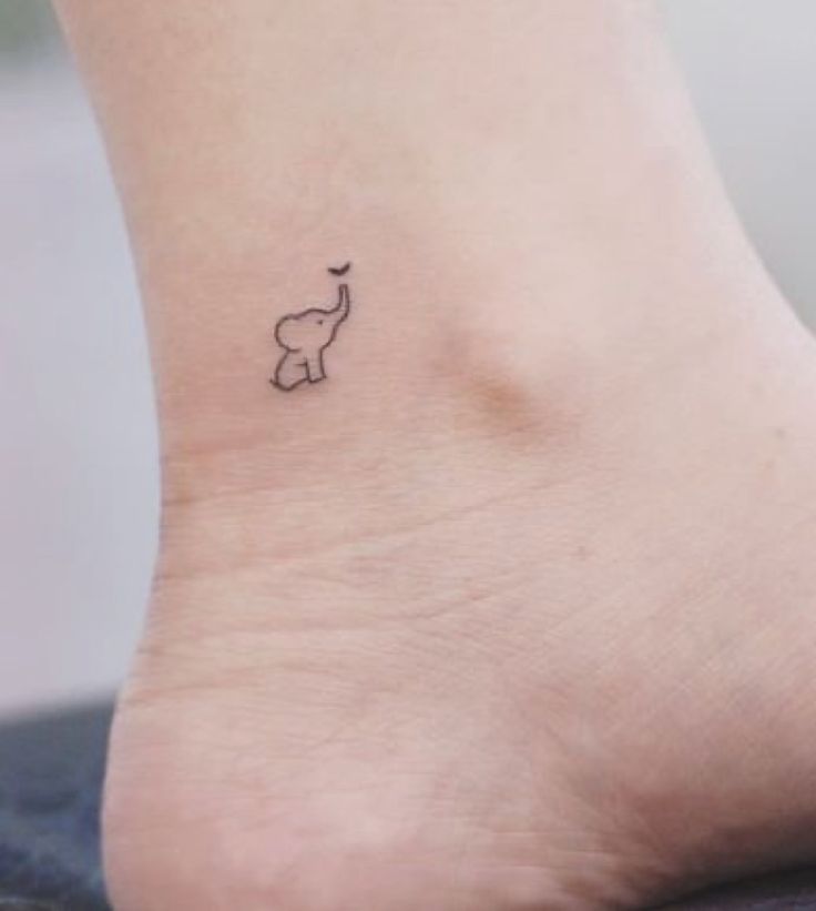 small elephant tattoo on the ankle