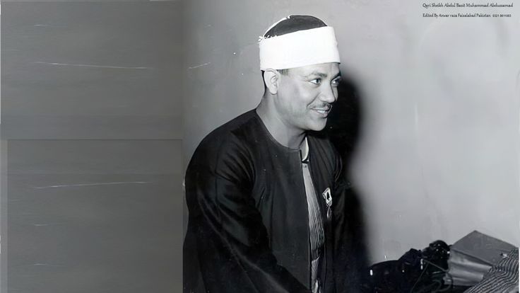 a black and white photo of a man wearing a head band