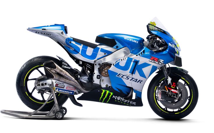 a blue and white motorcycle parked on top of a black stand in front of a white background