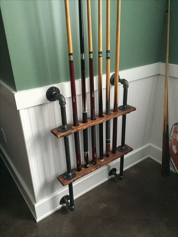 a rack that has some baseball bats on it