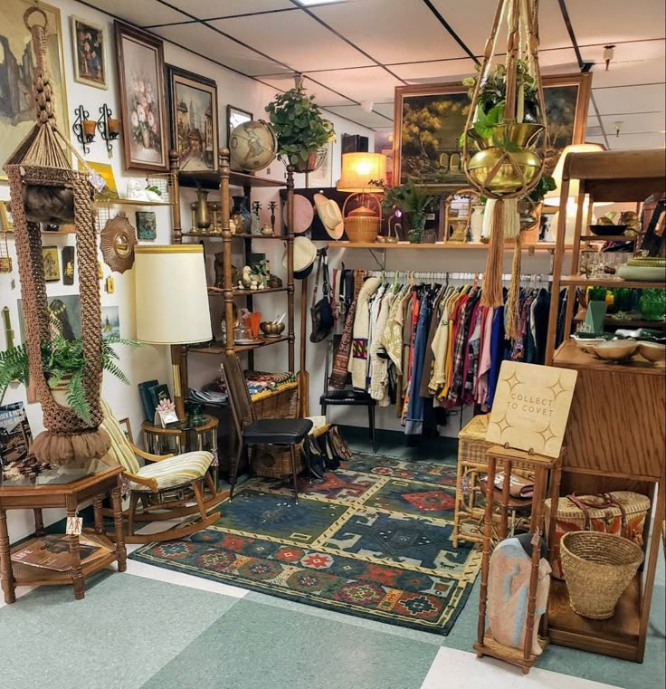 a room filled with lots of furniture and pictures on the wall next to a rug