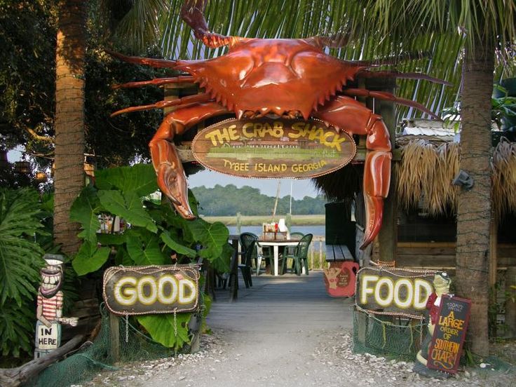 a sign that says the crab shack on it's front entrance to a restaurant